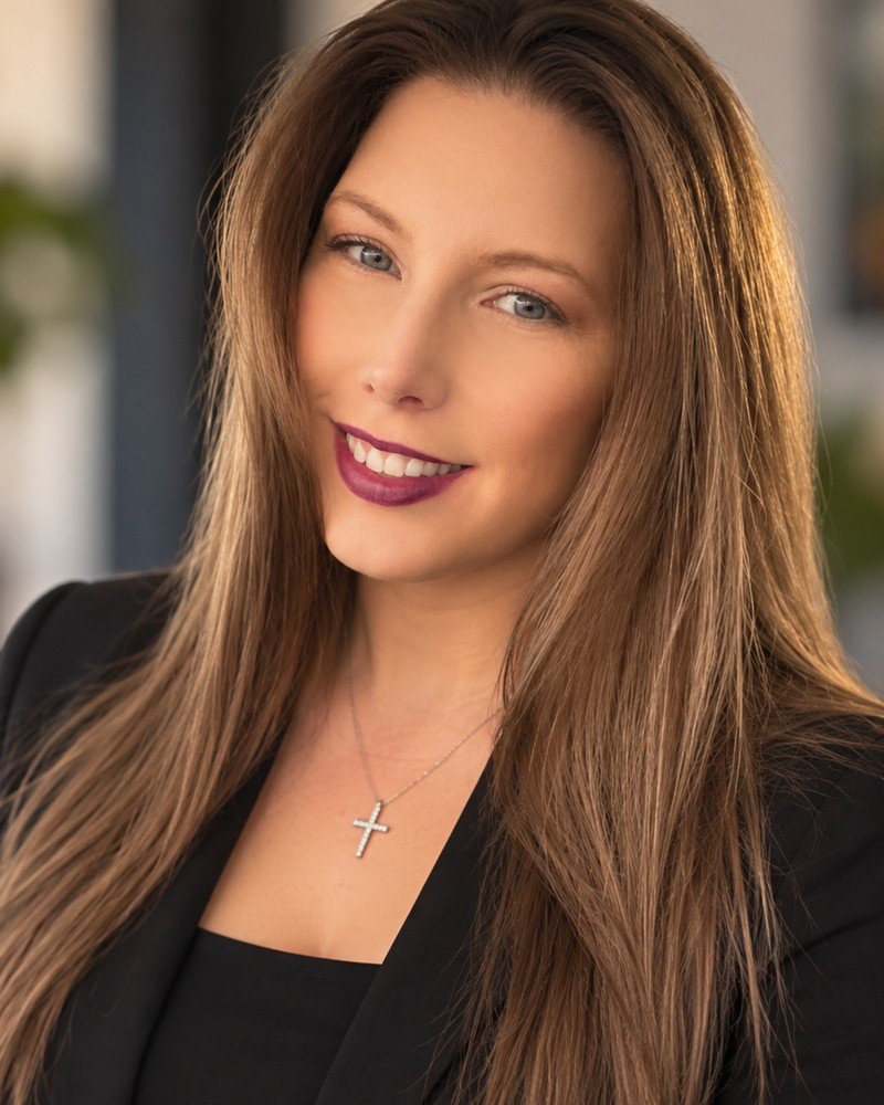 Kayla Song, REALTOR®, smiling in a black blazer